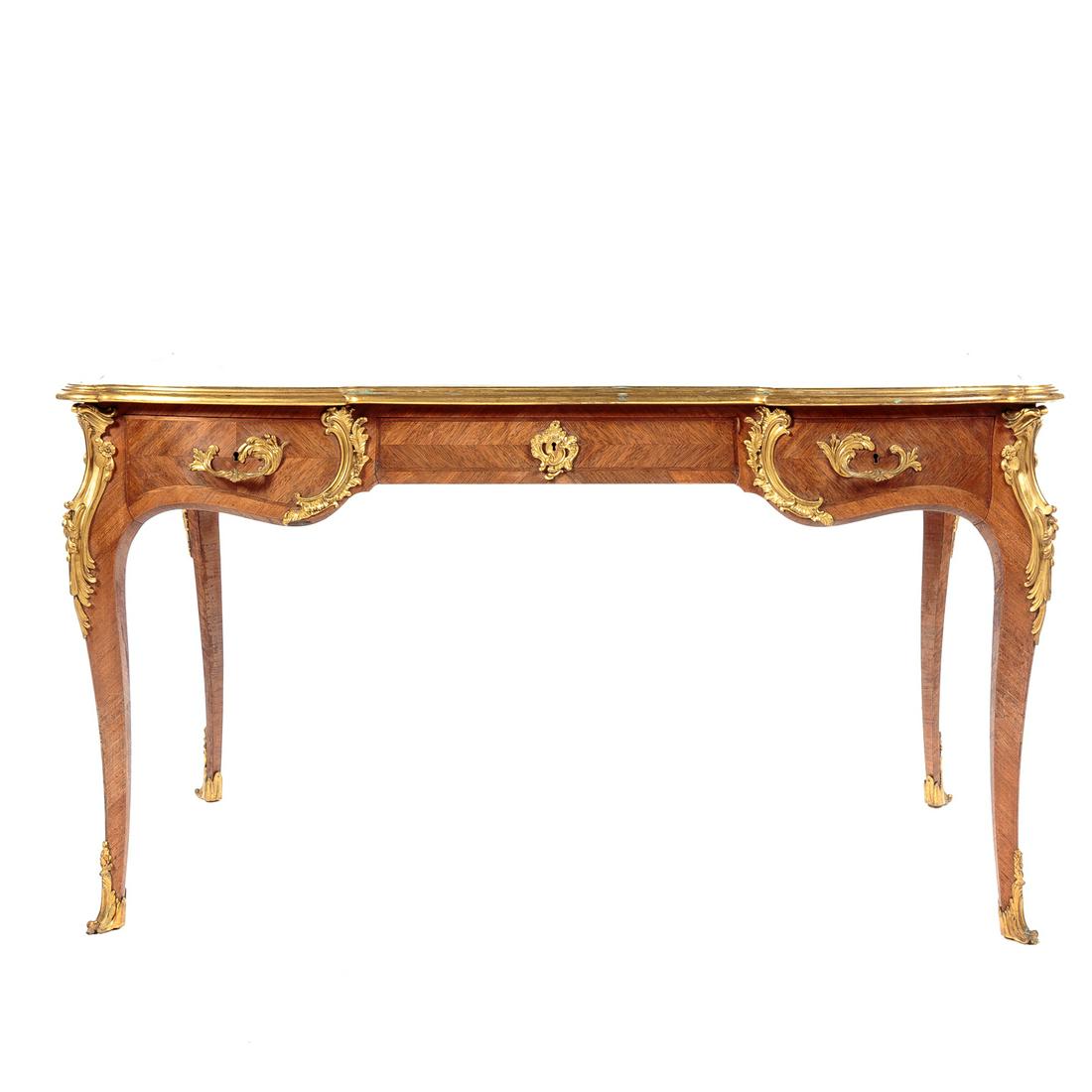 Paul Sormani Napoleon III Kingwood Bureau Plat: lock plate signed "P. SORMANI (1817-1877) PARIS, 10 rue Charlot", third quarter-19th century; black leather writing surface surrounded by shaped ormolu mounted edge, three parquetry drawers in shaped
