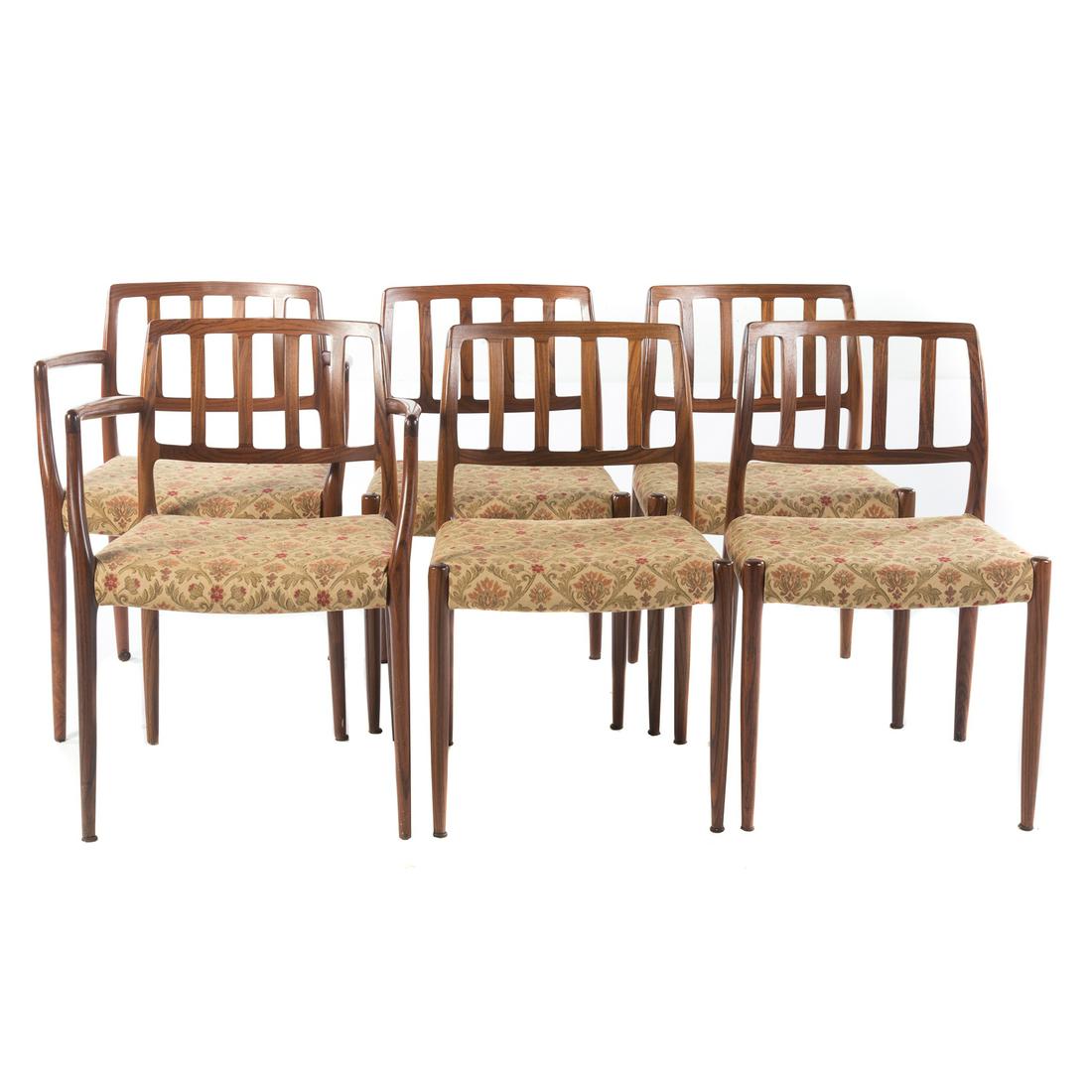 Six Danish Rosewood J.L. Moller Dining Chairs: Mid-20th century,, with slat-backs and upholstered seats on tapered legs; 31 in. H, 17 1/2 W., 19 in. D., 18 in. seat H.