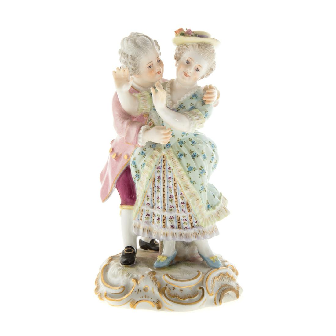 Meissen Porcelain Figural Group: late 19th century; underglaze blue crossed swords mark, incised/impressed marks "O141/144." Modeled as a lady resisting a kiss from a gentleman, 5 1/4 in. H.Estate of Leo and Martha Leckar. Acquired i