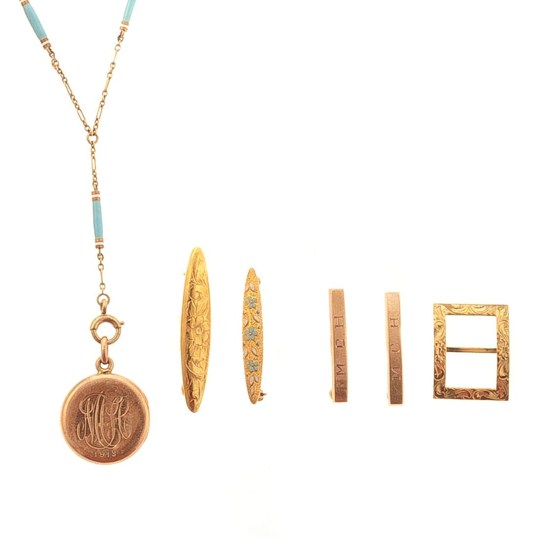An Enamel Locket & Collection of Baby Pins in 14K: 1) 14K yellow gold baby locket with light blue enamel and station chain, 15 in. L, 2) Pair of 14K baby pins with "MCH" monogram, 0.75 in. L, 3) 10K yellow gold scroll and floral engraved baby pin, 1.2