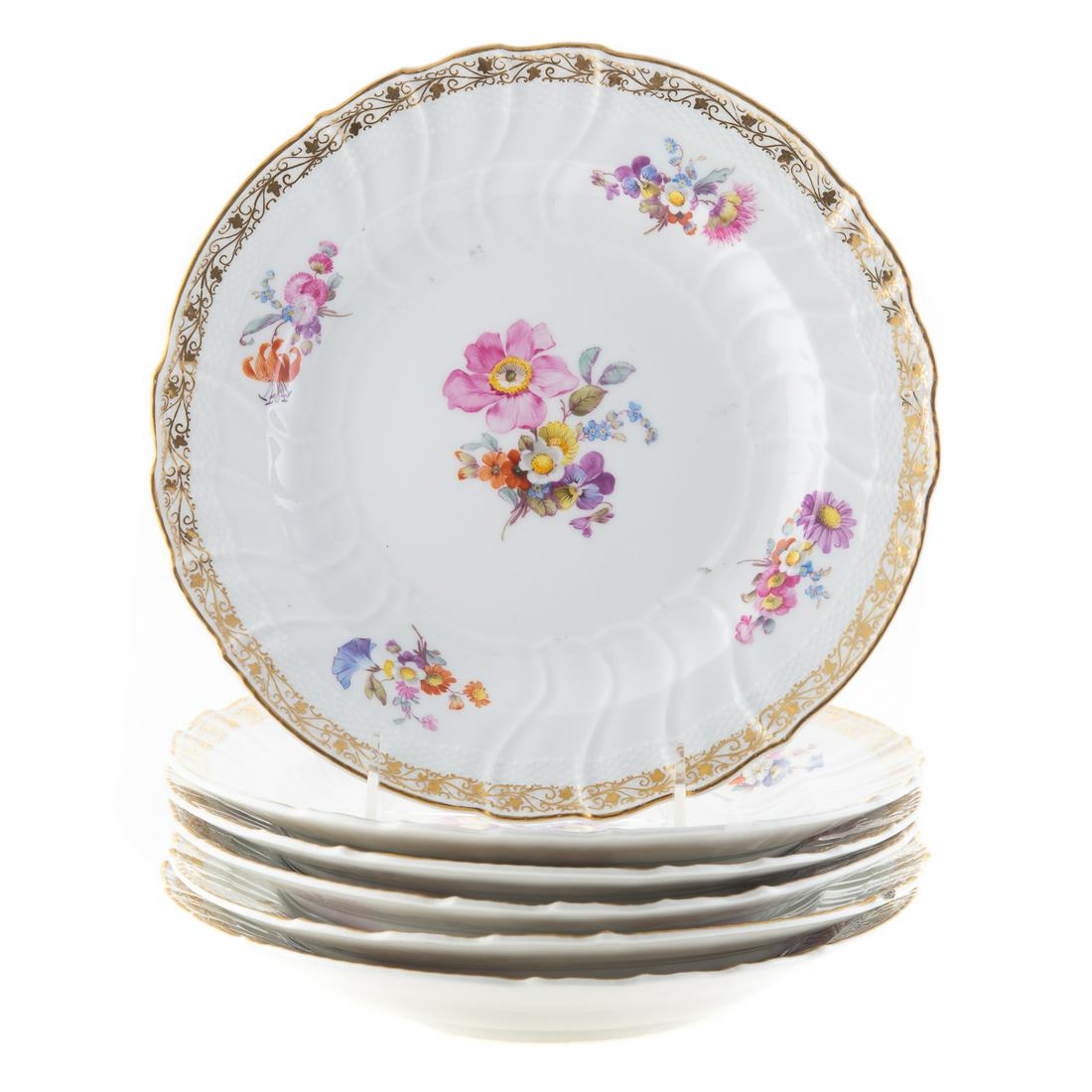 Six KPM Floral Decorated China Plates: early 20th century; gilt border, 10 in. Diam.