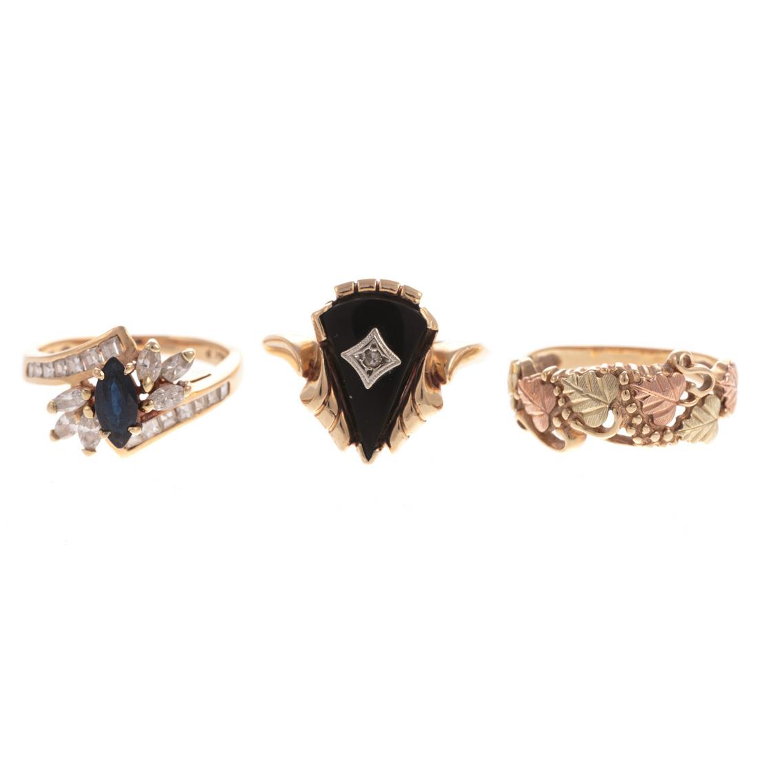 A Trio of Gemstone Rings in Gold (1 of 8)