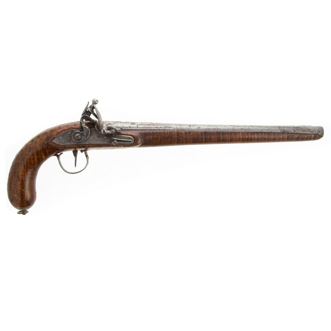 H.W. Mortimer English Flintlock Pistol: Lockplate marked I, Mortimer, and above that is the less pronounced H.W. mark. Pistol functions. Beautifully figured stock that is further decorated with inset gilt rosettes. Barrel has geometric deco