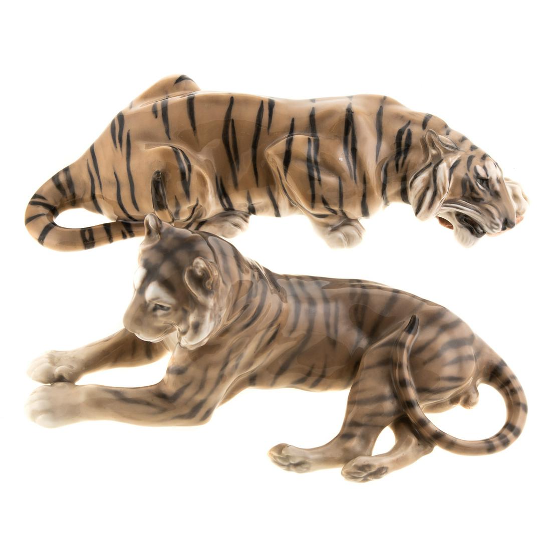 Two Royal Copenhagen Tigers: Reclining Tiger #714, 11 1/2 in L. Lying Tiger Eating Meat # 2065 14 in L.