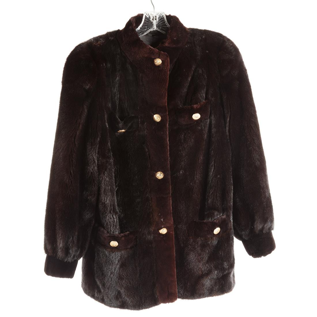 Ladies Black Mink Three Quarter Length Coat: With brown sheared mink trim along the collar, placket and pockets