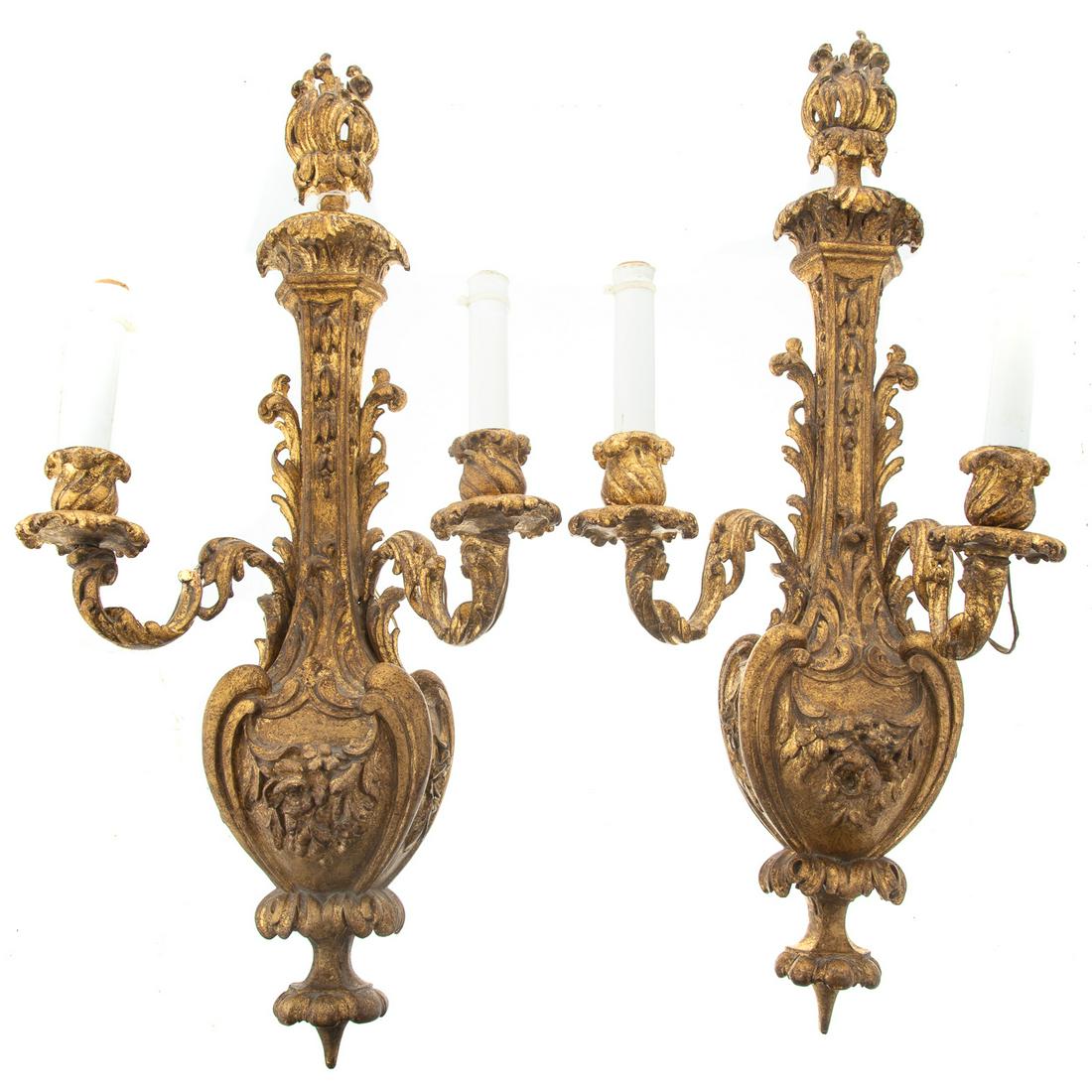 Pair of Italian Carved/Gilded Wood Sconces: First half, 20th century; well carved and gilded wood two light sconces, with electrified lights, 25 in. L.