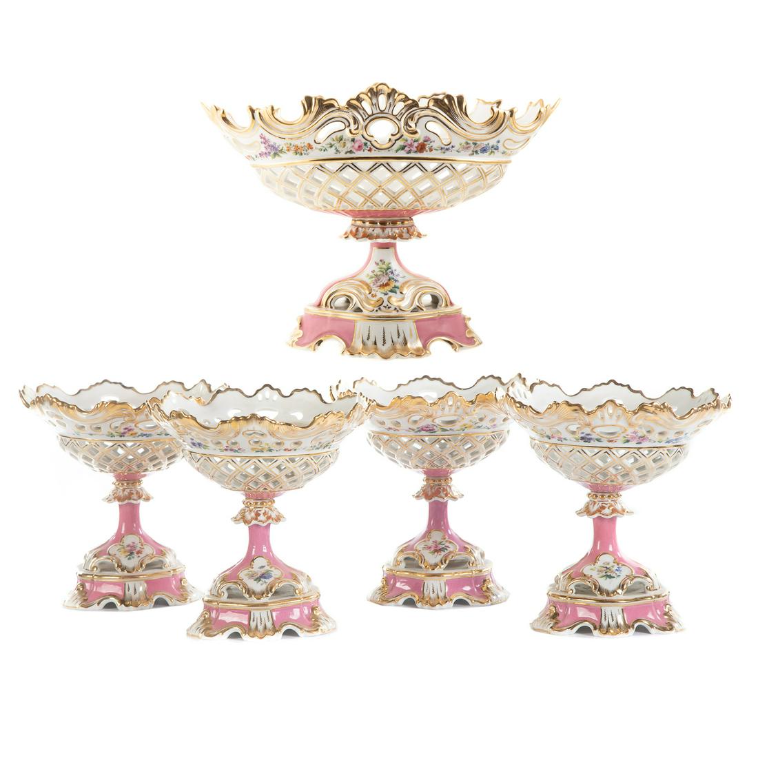 Five Piece Porcelain De Paris Table Garniture: Second half, 19th century; comprising one large and four matching smaller gilt and floral decorated reticulated compotes, large compote-11 1/2 in. H., 16 in. W. , small compotes-9 1/2 in. H., 9 in. Di