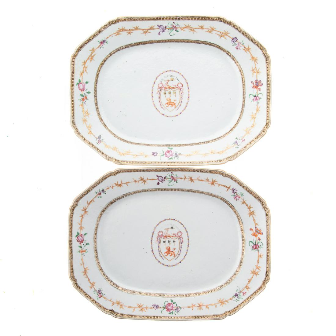 Pair Chinese Armorial Platters: Second half, 18th century; gilt chain border, interior band with gilt bamboo and Famille Rose flowers with unidentified heraldic armorial in center, 12 3/4 in. L., 9 1/2 in. W. From the collection of
