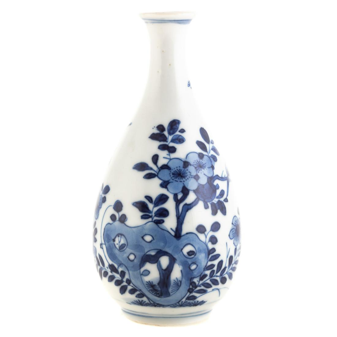 Small Chinese Blue/White Bottle Vase: Kangxi, circa 1700; with scholar's stone, flower and bird decoration, 4 3/4 in. H. Purchased from Stockspring Antiques, London, England on October 13, 1997. Property from the collection of Robert and 