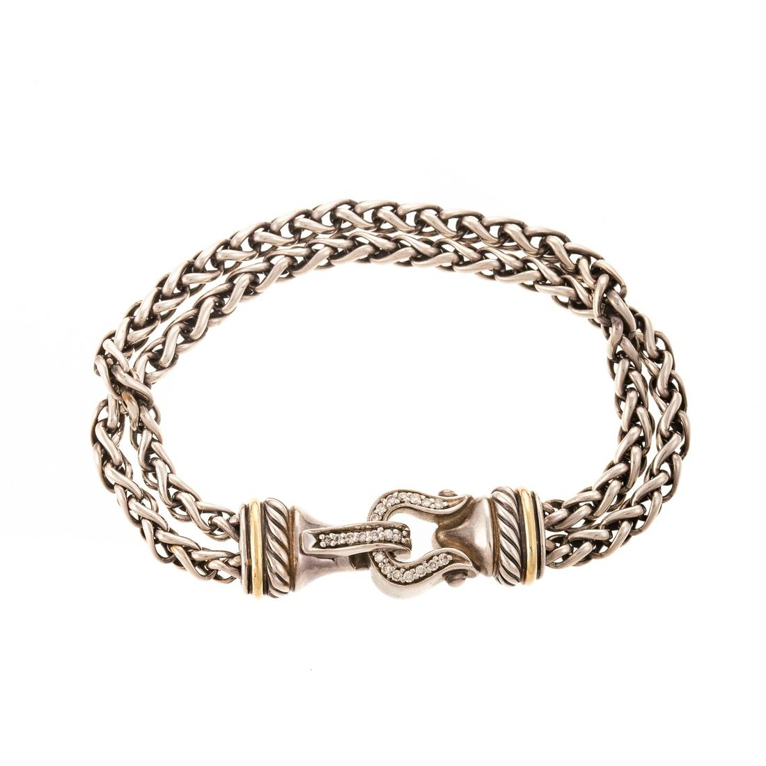 A David Yurman Sterling & Diamond Buckle Bracelet: Sterling silver double wheat chain bracelet by David Yurman with buckle clasp set with round diamonds and gold accents, fold over snap closure, 7 in. L., stamped "D.Y." 25.2 grams