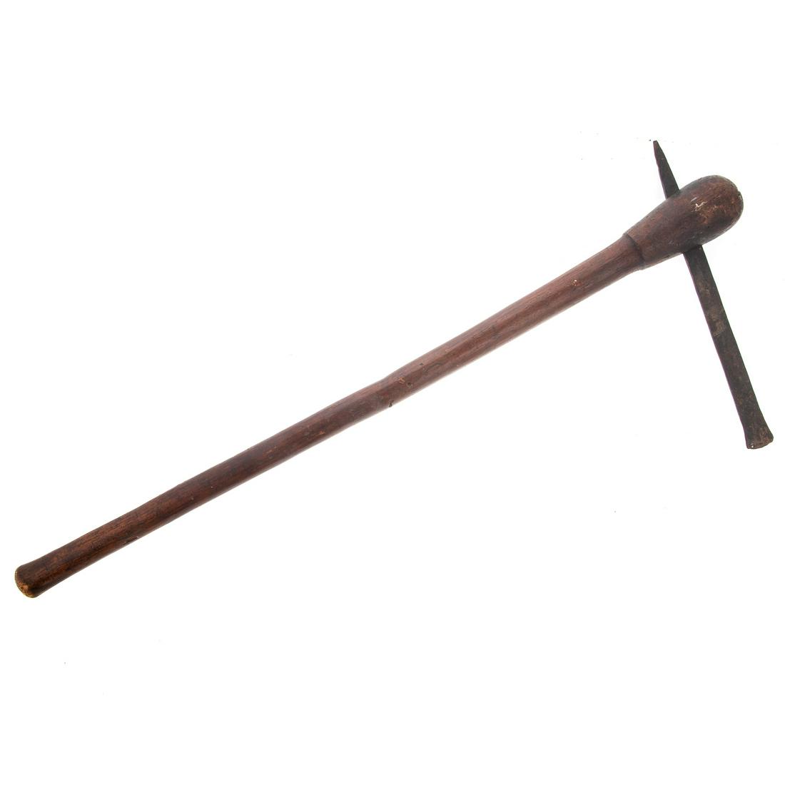 Native American Tomahawk: carved wood shaft with forged metal blade, 24 1/2 in. From the Estate of Philip Dubey.