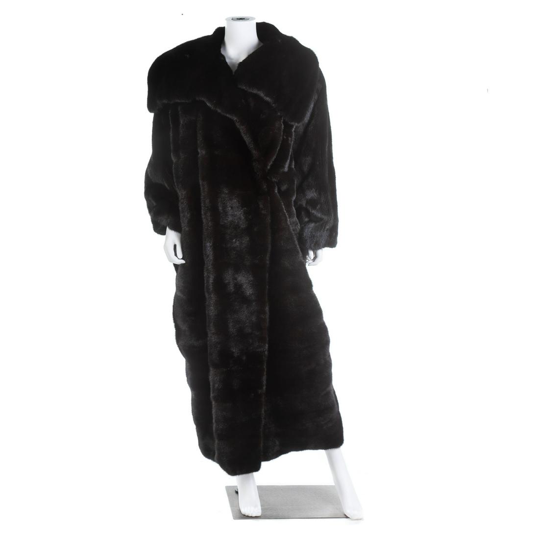 A Bill Blass Dark Brown Mink Coat: Retailed by William Furs, Reno, NV, shawl collar, full length.