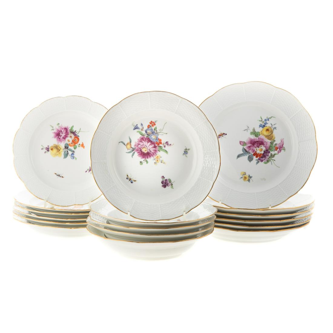 17 Pieces Meissen Porcelain Dinnerware: Waving molded basket weave border and painted floral decoration, includes: 6 dinner plates, 6 luncheon plates and 5 soup bowls.