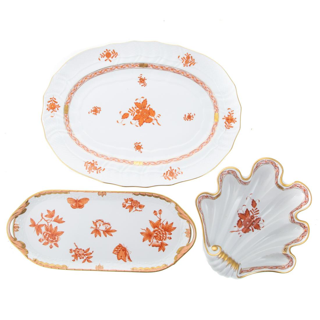 Three Herend Table Articles: In the Rust Chinese Bouquet pattern, includes; oval double handle tray, 14 in. L., 6 in. W., shell form dish, 9 in. L., 8 1/2 in. W. and oval platter, 15 in. L., 11 in. W.