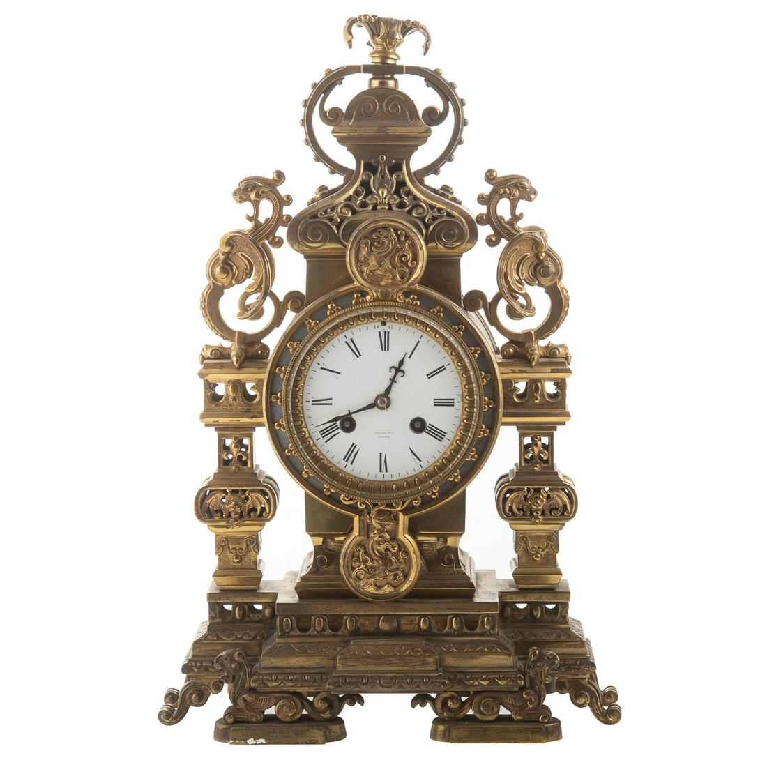 Tiffany Renaissance Revival Bronze Clock: Late 19th century; elaborate cast bronze case with griffins, enamel dial marked "Tiffany & Co. New York," and works stamped same, 17 in. H.