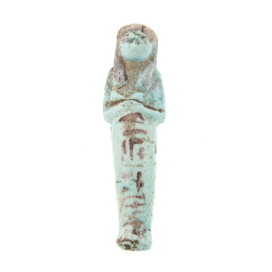 Ancient Egyptian Faience Ushabti: Late B.C. era; pharoahinic form with hieroglyphics, 5 in. L. From the Estate of Philip Dubey. Acquired by consignor on trip to Egypt in the 1970s.