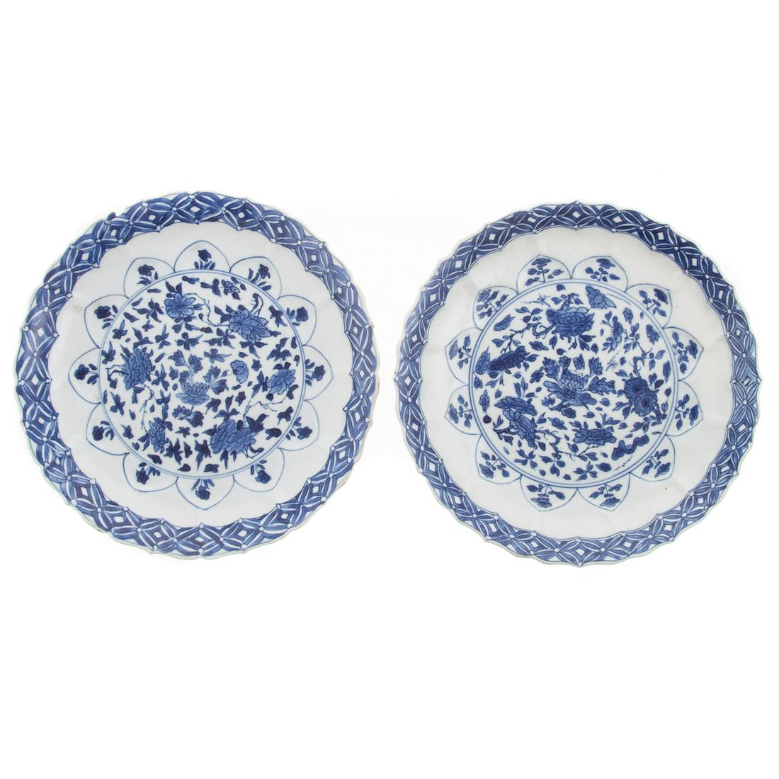 Pair Chinese Export Lotus Plates: Circa 1700, Kang Xi: blue/white plates, with molded petal decoration, cross hatch border and painted floral decoration, character mark. 8 in. Diam.