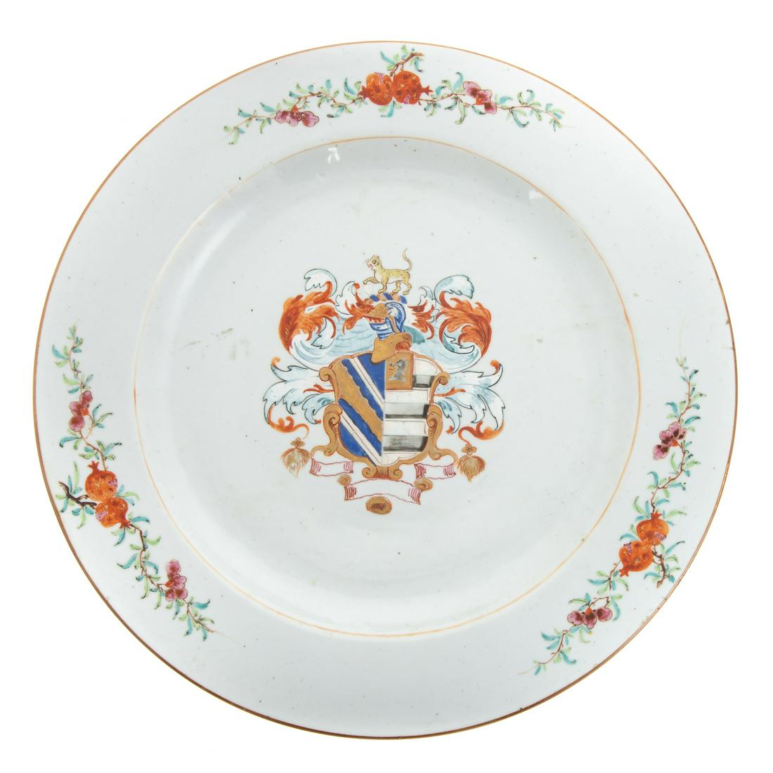 Large Chinese Export Armorial Charger: Circa 1760; pomegranate decorated border with central heraldic armorial, 14 in. Diam. From the Estate of Philip S. Dubey.