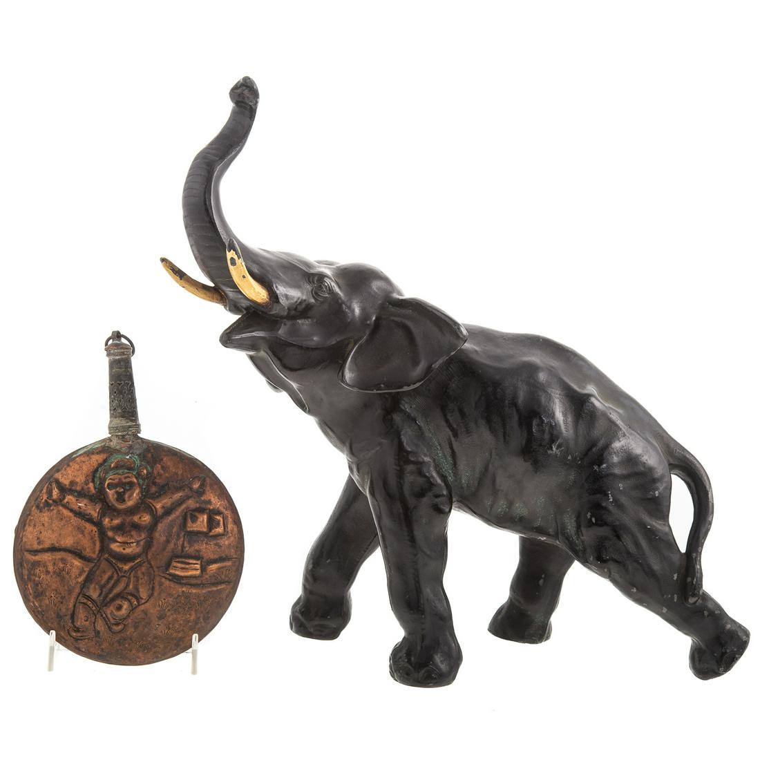 Asian Patinated Metal Elephant & Copper Moon Flask: Figure of charging elephant, 14 in. H. and copper moon flask with figural relief decoration, 7 1/2 in. L., 5 1/2 in. Diam.