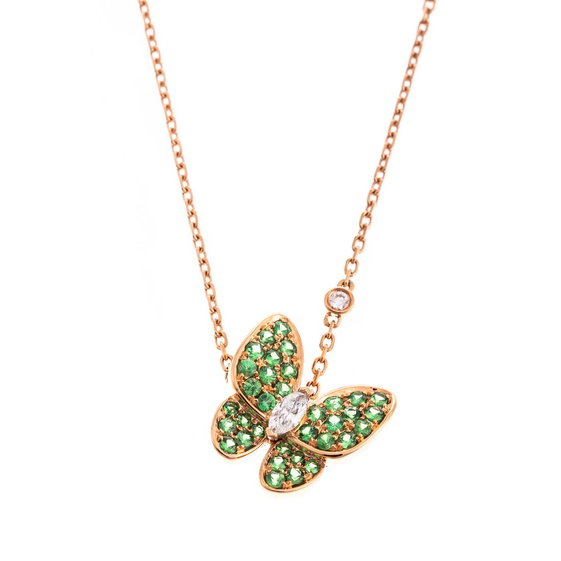 A Van Cleef & Arpels Two Butterfly Pendant in 18K: 18K rose gold pendant from Van Cleef & Arpels' Two Butterfly collection features butterfly with wings pave set with round tsavorite garnets and marquise diamond center, 0.5 in. L., with single floatin