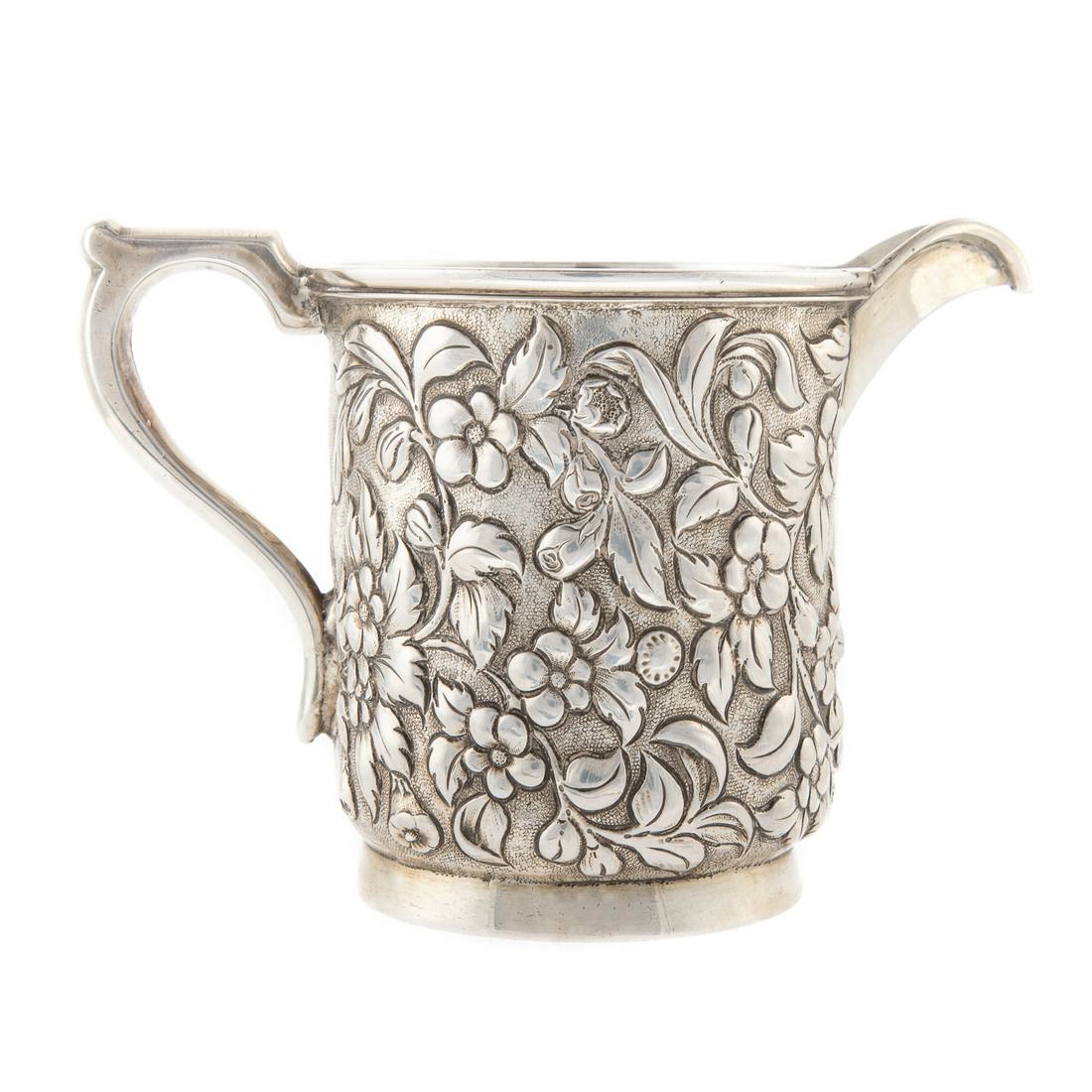 S. Kirk & Son Sterling Silver Repousse Creamer: Mark partially rubbed and scratched, cylindrical, body in allover floral repousse, inscribed "J. O'Brien," 3 3/4 in. H., 8.3 ozt. William James O'Brien, 1836-1905. Baltimore attorney, judge and U.S. C