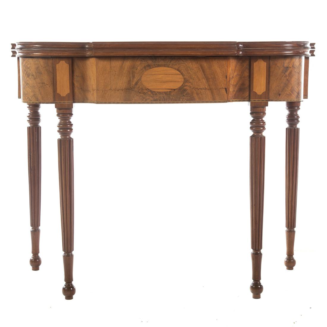 Federal Style Mahogany Flip-Top Games Table: Early 20th century; bench-made, with shaped front and inlay. 29 in. H., 36 in. W., 18.5 in. D.