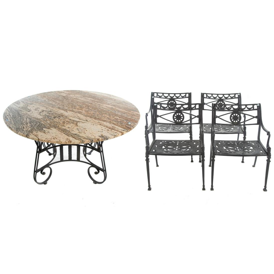 Classical Style Four Piece Patio Set: Comprising a circular marble top table with cast iron base, and set of four elaborate cast metal chairs with dolphin arm supports. Table measures 30 in. H., 50 in. Diam.
