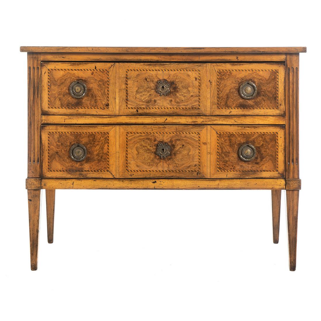French Inlaid Walnut Two-Drawer Commode: Late 19th/early 20th century; with barber pole inlaid drawer fronts, reeded supports and square tapered legs. 32 in. H., 42 in. W., 18.5 in. D.