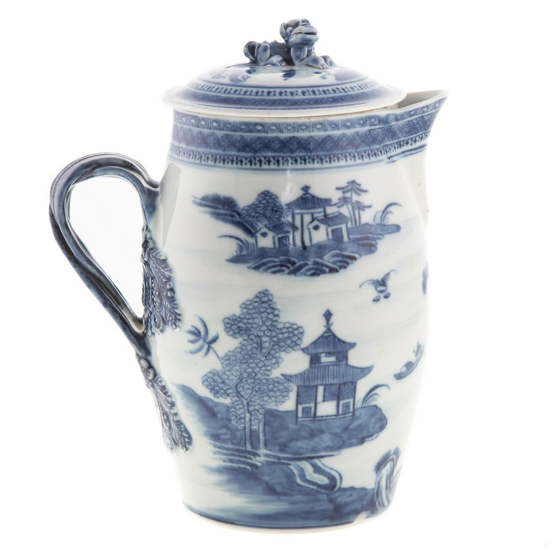 Chinese Export Nanking Cider Flagon: Circa 1760-70; with meandering river scene and pagoda decoration and double strap handle, lid having foo dog knop, 9 in. H. From the Estate of Philip S. Dubey.