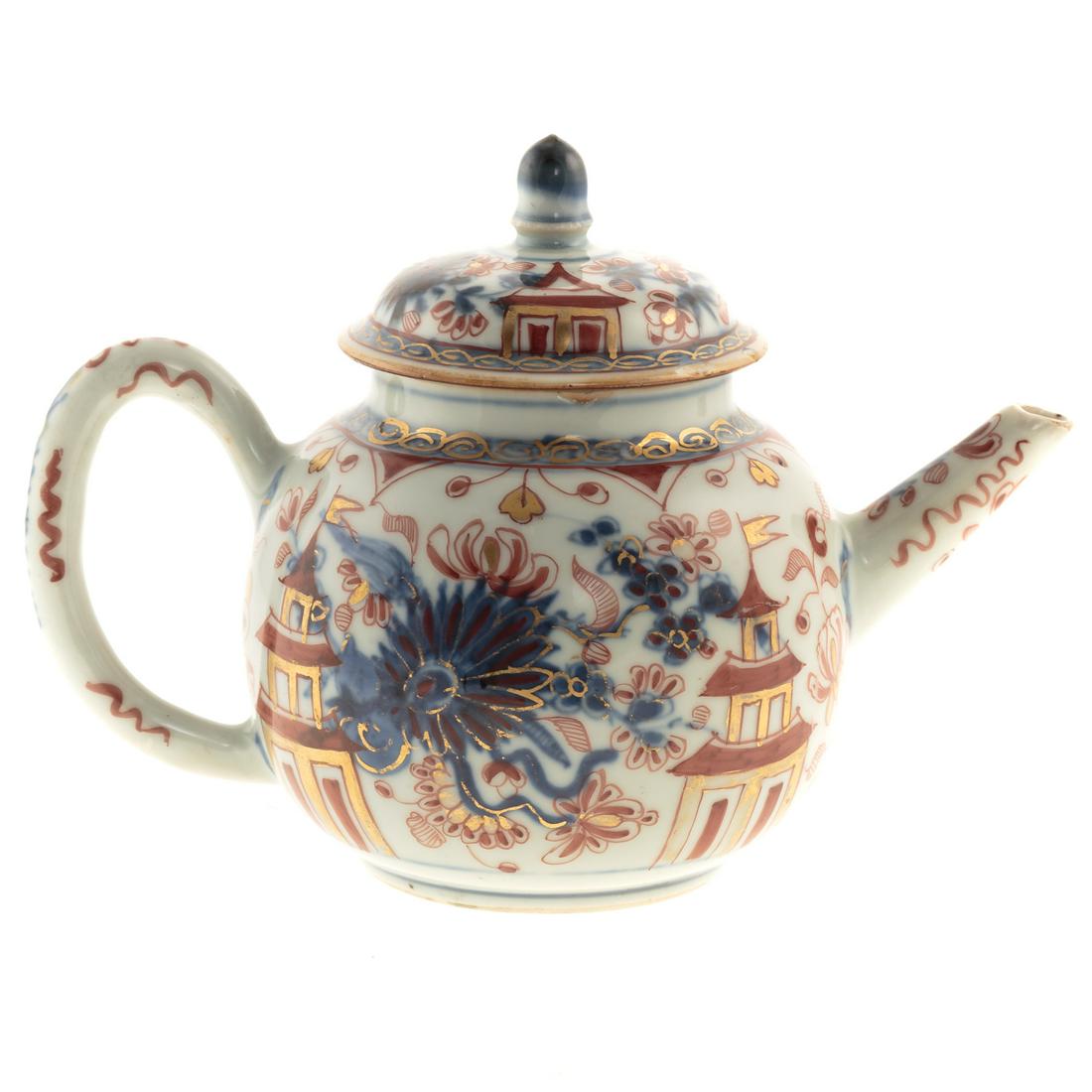 Chinese Export Imari Globular Teapot: Kang Xi, circa 1710-20; ribbed globular form with floral and pagoda decoration, 5 in. H. From the Estate of Philip S. Dubey.