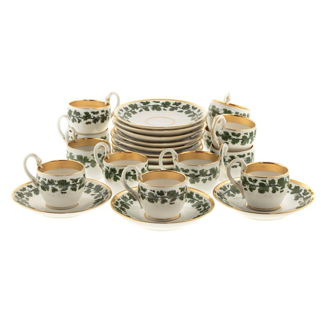 12 Meissen Porcelain Grapevine Teacups/Saucers: 20th century; having green vine band and extensive gilt accents, cups with swan form handles, cups - 3 in. H., 2 1/2 in. Diam., saucers - 5 3/4 in. Diam.