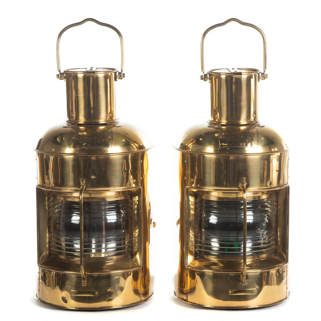 Pair of Nippon Side Light Ships Lanterns: Circa 1920s-30s; Large brass signal lanterns with handle and mounting clip, with molded glass globes. 19 in. H., 9.5 in W.
