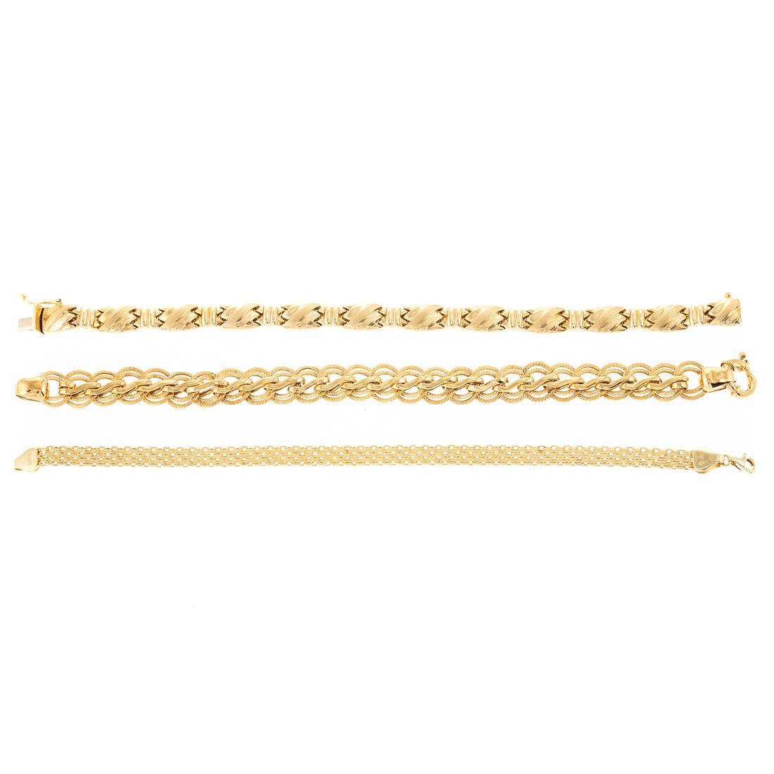 A Trio of 14K Yellow Gold Link Bracelets: 1) 14K yellow gold tightly woven link bracelet with lobster clasp, 7.5 in. L., 2) 14K yellow gold bracelet with smooth and textured round links, spring ring clasp, 7.5 in. and 3) 14K yellow gold brace
