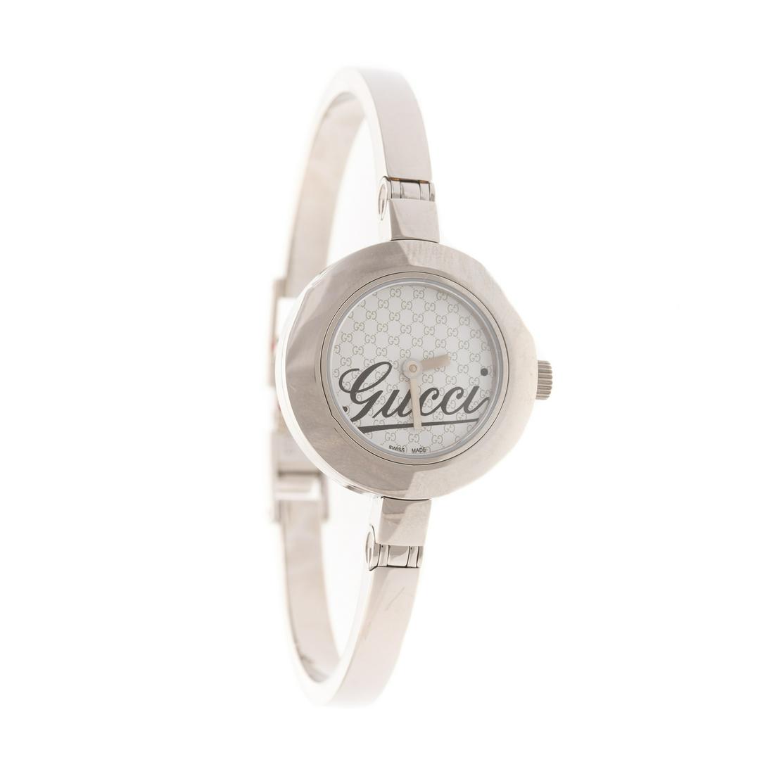 Gucci Lady's Bangle Watch with Box & Papers: Lady's Gucci stainless steel watch in box with papers, Gucci logo face, fold over clasp