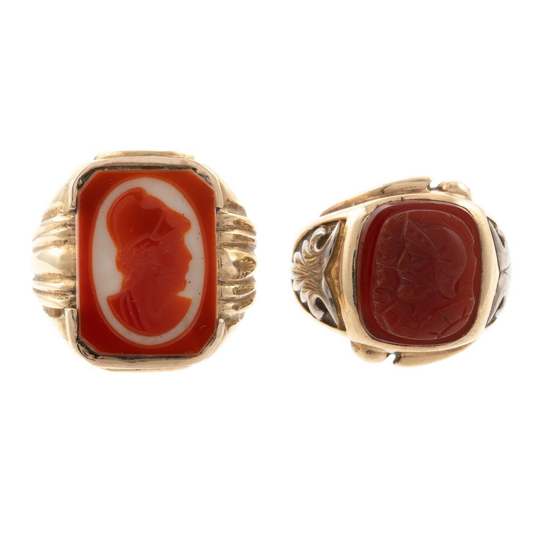 Two Hardstone Roman Soldier Rings in 10K: 1) 10K yellow gold ring featuring a two toned hardstone carved profile of Roman soldier, high polished ridged shank, sz 10.5, 2) 10K yellow gold ring featuring a cushion shape carnelian carved to depi