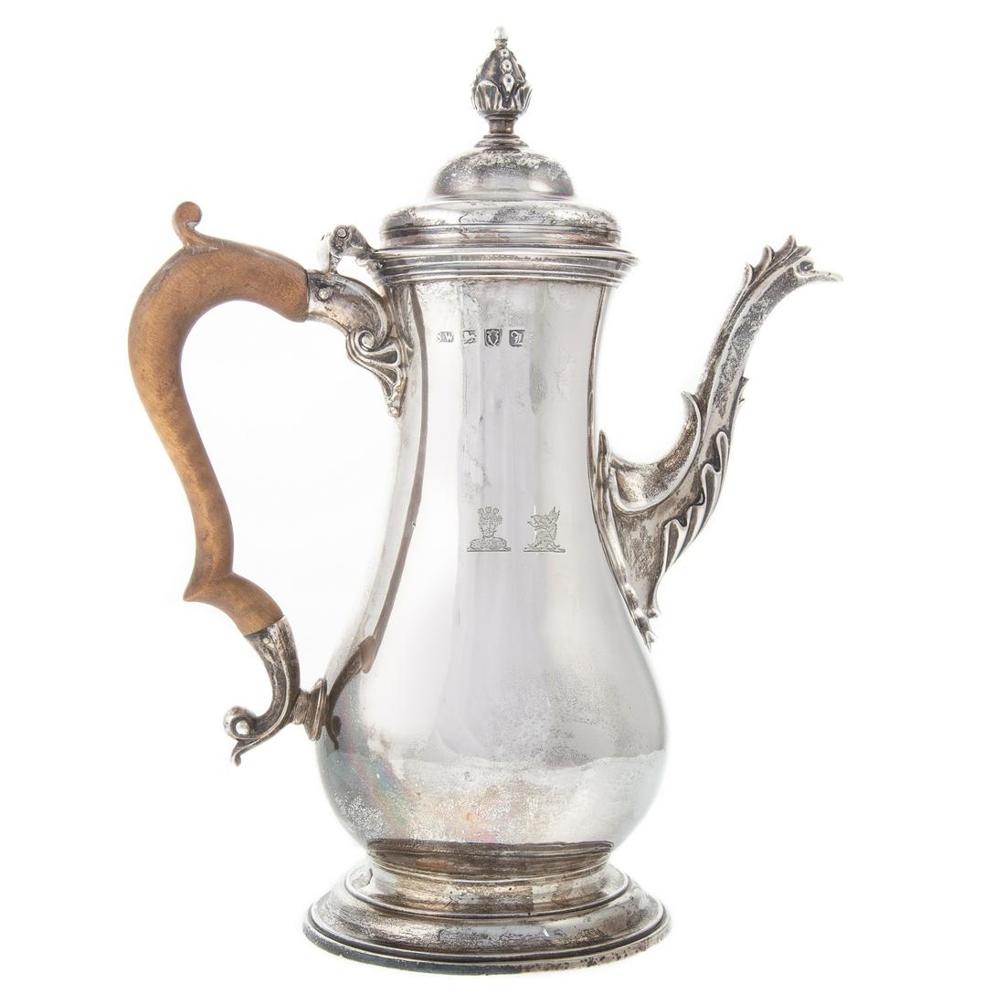 George III Silver Armorial Coffee Pot: Samuel Whitford I, London, 1766; baluster-form, on a stepped dome foot, foliate-capped spout, treen handle, the hinged cover with decorative urn finial, the body with two finely chased armorials, 10 3