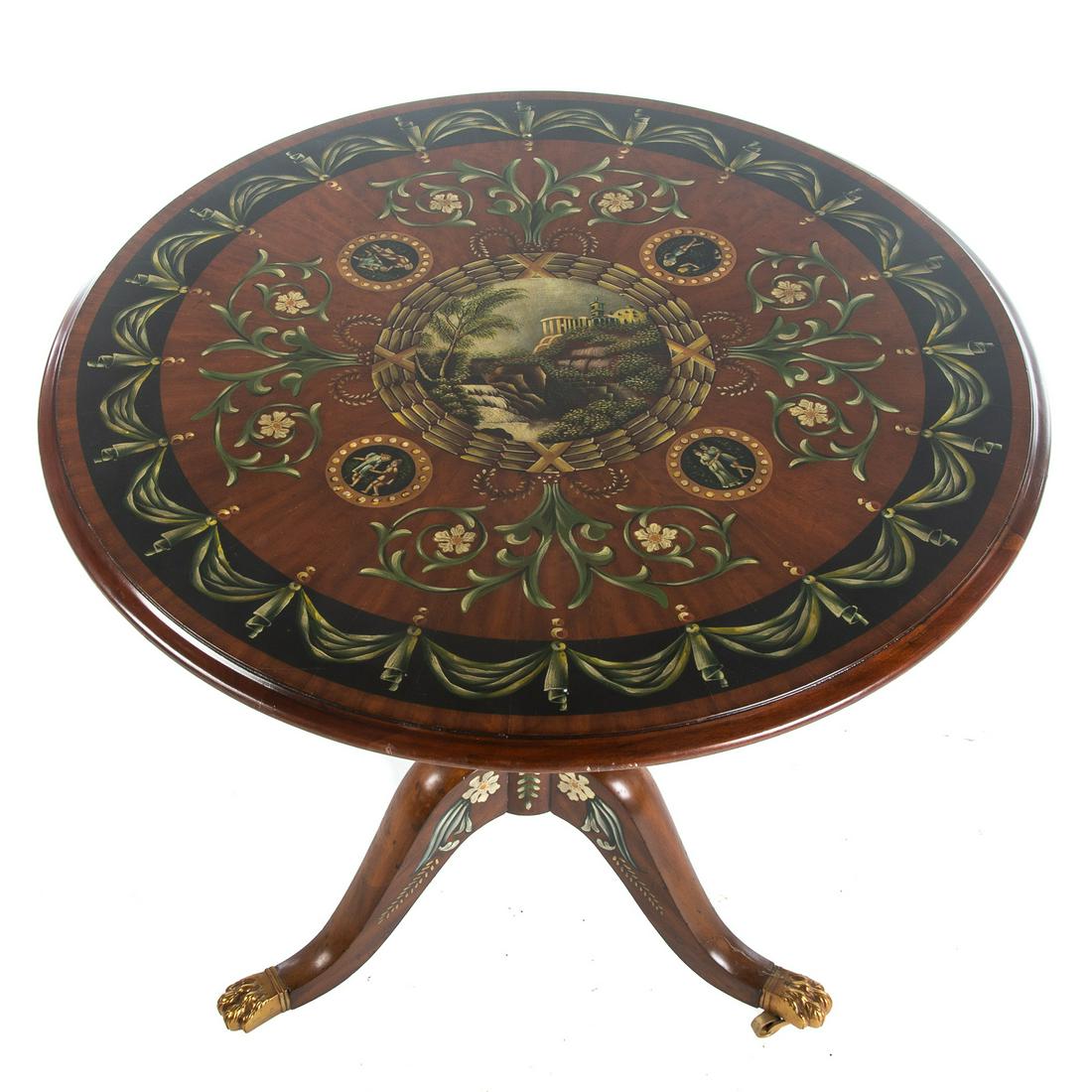 Adam Style Painted Tilt Top Tea Table: 20th century; elaborately painted top shaft and legs, with brass paw feet on castors. 29 in. H., 30 in. Diam.
