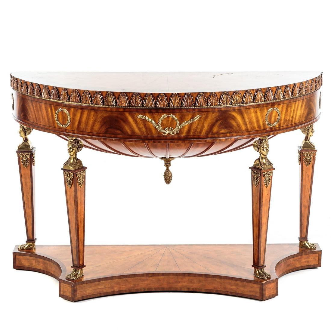 Maitland Smith Empire Style Demilune Console: Mahogany and mixed wood inlaid demilune console, with brass gilt mounts. 36 in. H., 58 in. W., 23 in. D. From the Private Collection of John Paterakis Jr. H&S Bakery, Baltimore, MD.