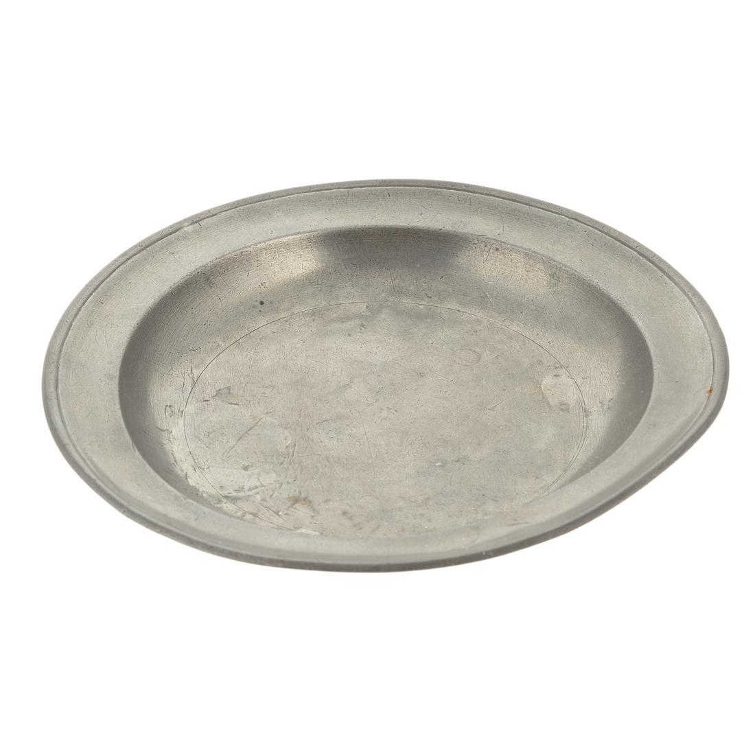 American Pewter Plate, by Sylvester Griswold: Baltimore, Maryland, circa 1820; with touch mark on verso, 10 3/4 in. Diam. Sylvester Griswold was born in Connecticut in 1791 and worked as a pewter smith in Baltimore from 1819-22.