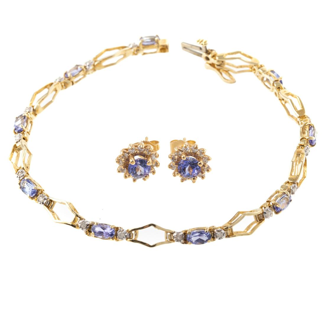 A Tanzanite Bracelet & Earrings in 14K Yellow Gold: 1) 14K yellow gold bracelet featuring oval cut tanzanite and round cut diamonds, hidden box clasp with safety, 7.25 in. L, and 2) 14K yellow gold earrings featuring round cut tanzanites surrounded by 