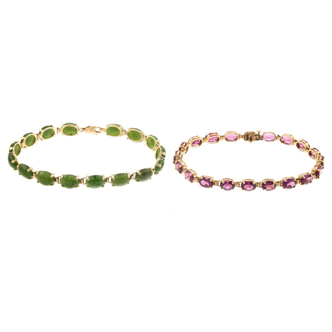 A Pair of Gemstone Link Bracelets in Gold: 1) 14K yellow gold bracelet featuring 5 x 7 mm oval rhodolite garnets set in prongs with hidden box clasp and snap under safety, 7.25 in. L, and 2) 10K yellow gold oval nephrite jade link bracelet wit