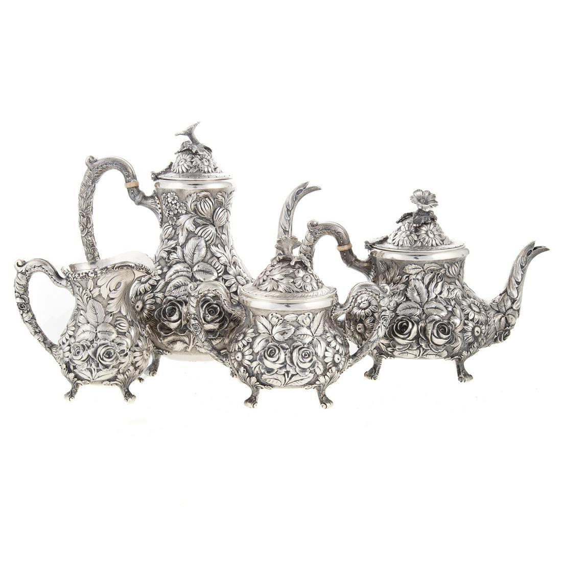 4-Piece Stieff Hand-Chased Sterling Tea/Coffee Service: 1946 date mark, model 700; including coffee pot, teapot, creamer and sugar, each in hand-chased floral repousse decoration; coffee pot is 9 1/2 in. H, 89.35