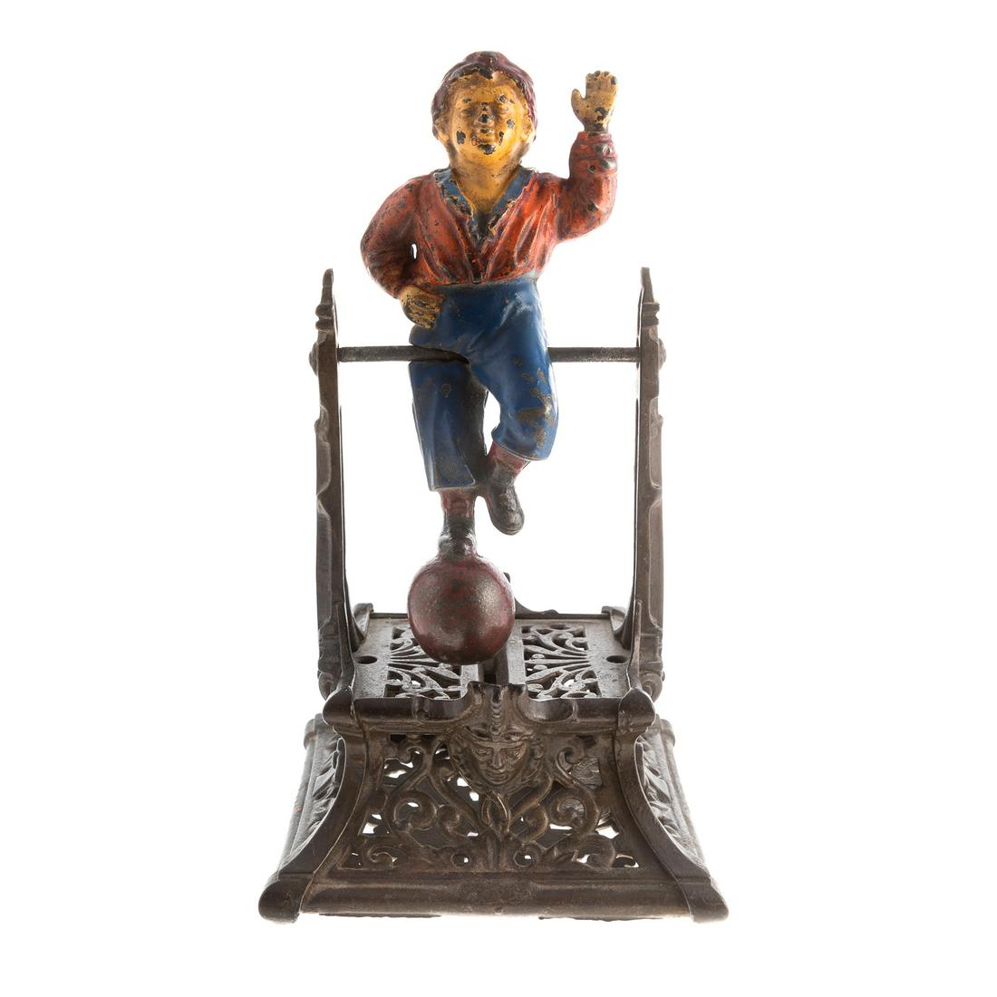 Boy on Trapeze Cast Iron Mechanical Bank: Circa 1895; by Barton & Smith, 9 1/2 in. H.