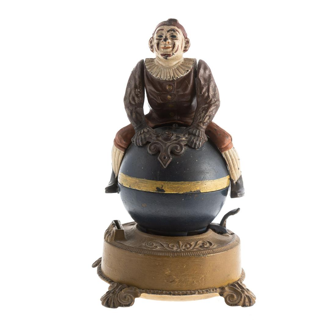Clown on Globe Cast Iron Mechanical Bank: Patented 1890; by J & E Stephens Co., 8 1/2 in. H.