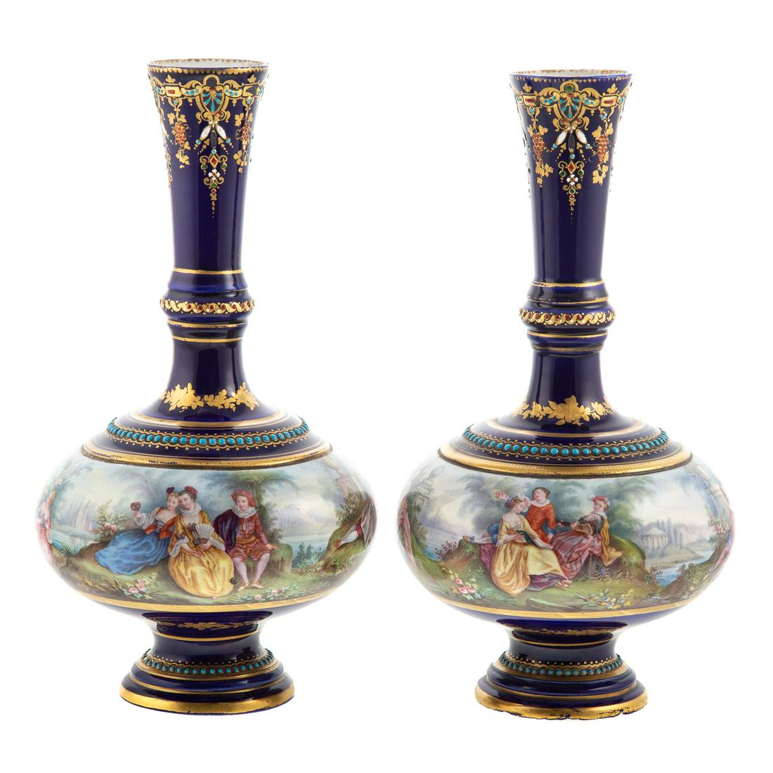 Pair Sevres Bleu de Roi Porcelain Bottle Vases: Late 18th century; bleu de roi ground with gilt floral accents and applied pearling with band showing painted meandering scene of lovers in Arcadian garden, mark underneath, 10 in. H. From the Estate