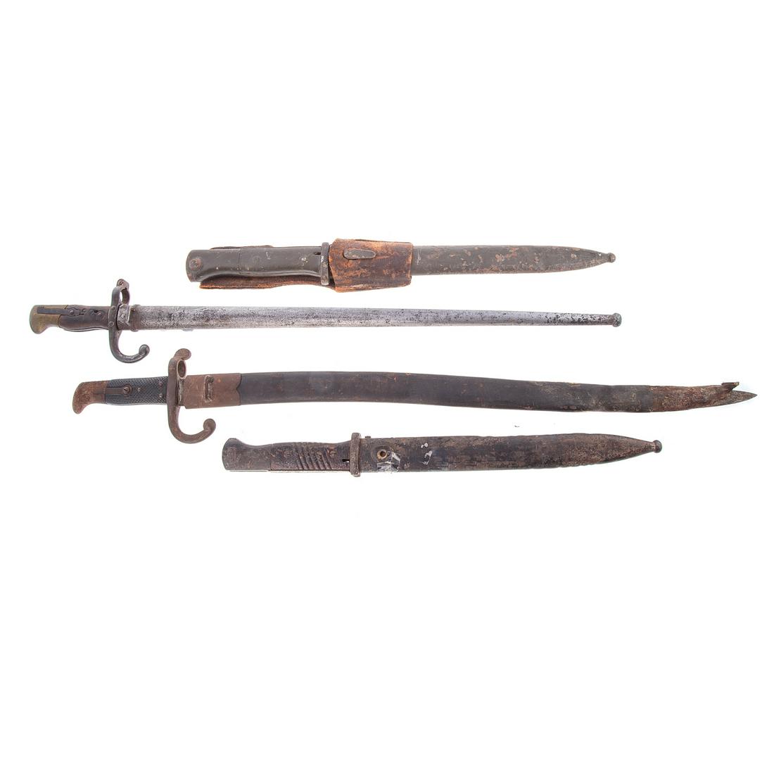 Assorted German Bayonets: K98 bayonet with sheath, WW 1 bayonet marked Erfurt w/sheath and frog, WW 1 bayonet marked Weyersberg, Solingen with sheath and frog and another WW 1 possibly German bayonet with sheath