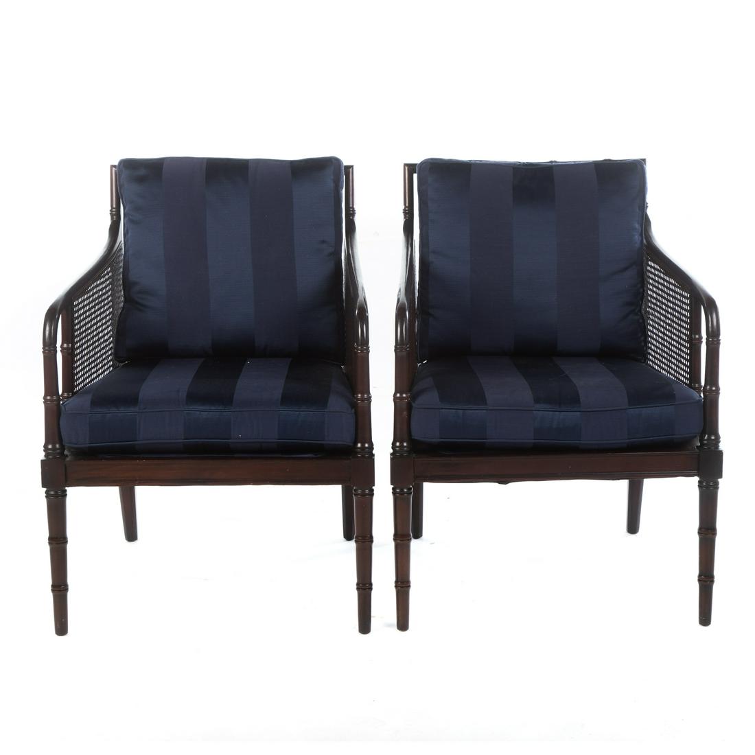 Pair of Hickory Chair Mahogany & Cane Arm Chairs: Mahogany with faux bamboo motif in the Sheraton style, with turned crest rail over a cane back panel, having sloped armrests over cane side panels, on turned and taper legs, with removable upholstered