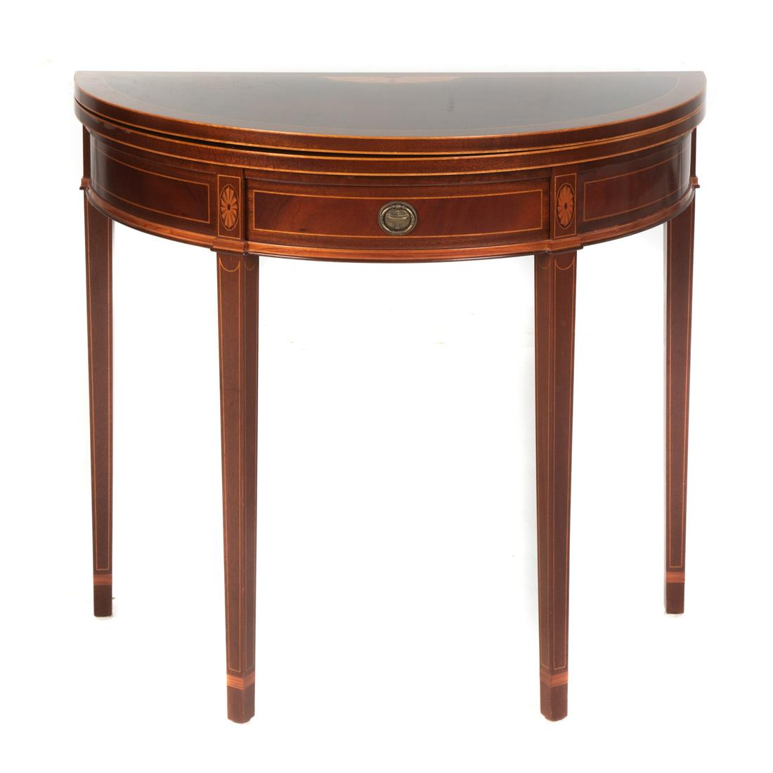 Mahogany & Rosewood Inlaid Demilune Games Table: Federal style, with single drawer, having patera and stringer inlay, with Hepplewhite style legs. 30 in. H., 35 in. W., 17.5 in. D.