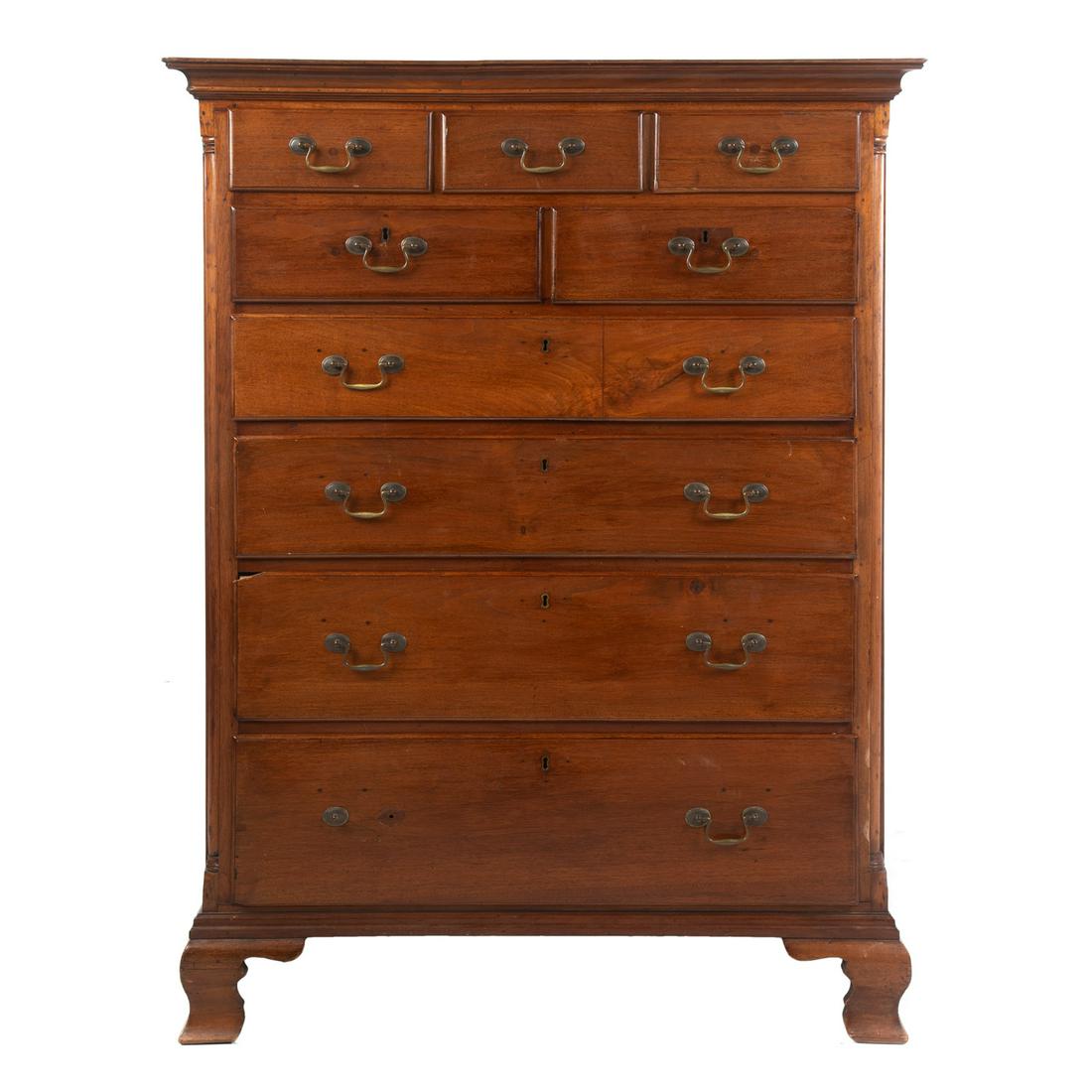 American Chippendale Walnut Semi-Tall Chest: Pennsylvania, circa 1770; three short drawers over two short drawers over four graduated long drawers, on bracket feet, 54 in. H., 41 in. W., 22 in. D.