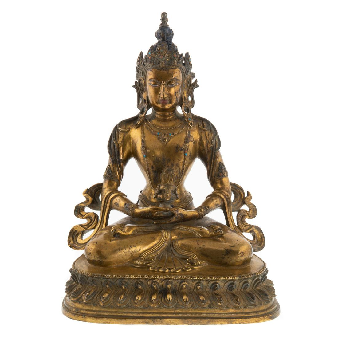 Chinese Bronze Seated Buddha: Probably 19th century; figure on double lotus, with inset jewel chips and traces of pigment, loose underneath plate engraved with rosette, 12 in. H.